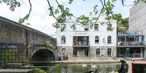 narrowboat pub seen from across the canal